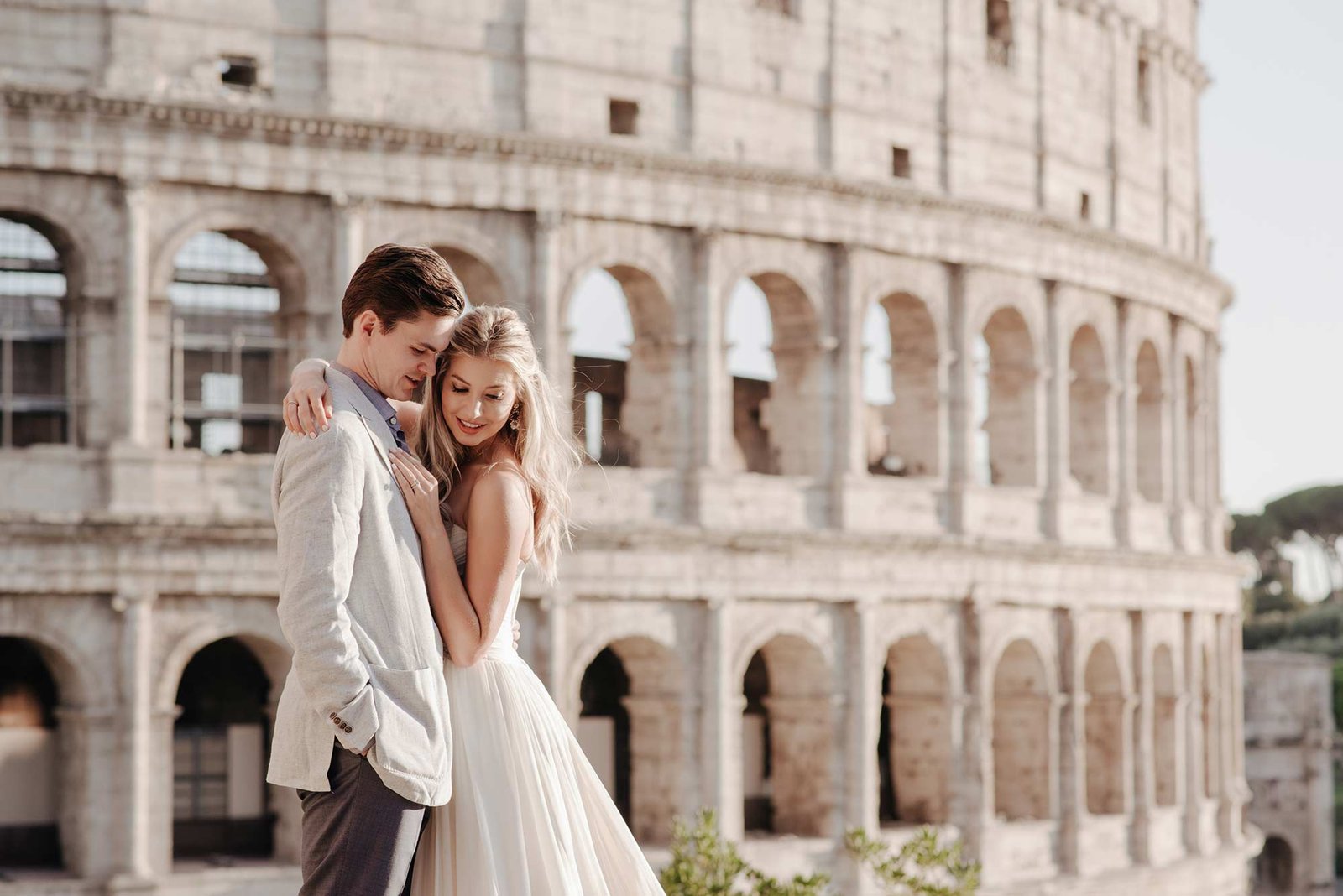 Romantic couple portrait in front of the Colosseum during a Rome elopement