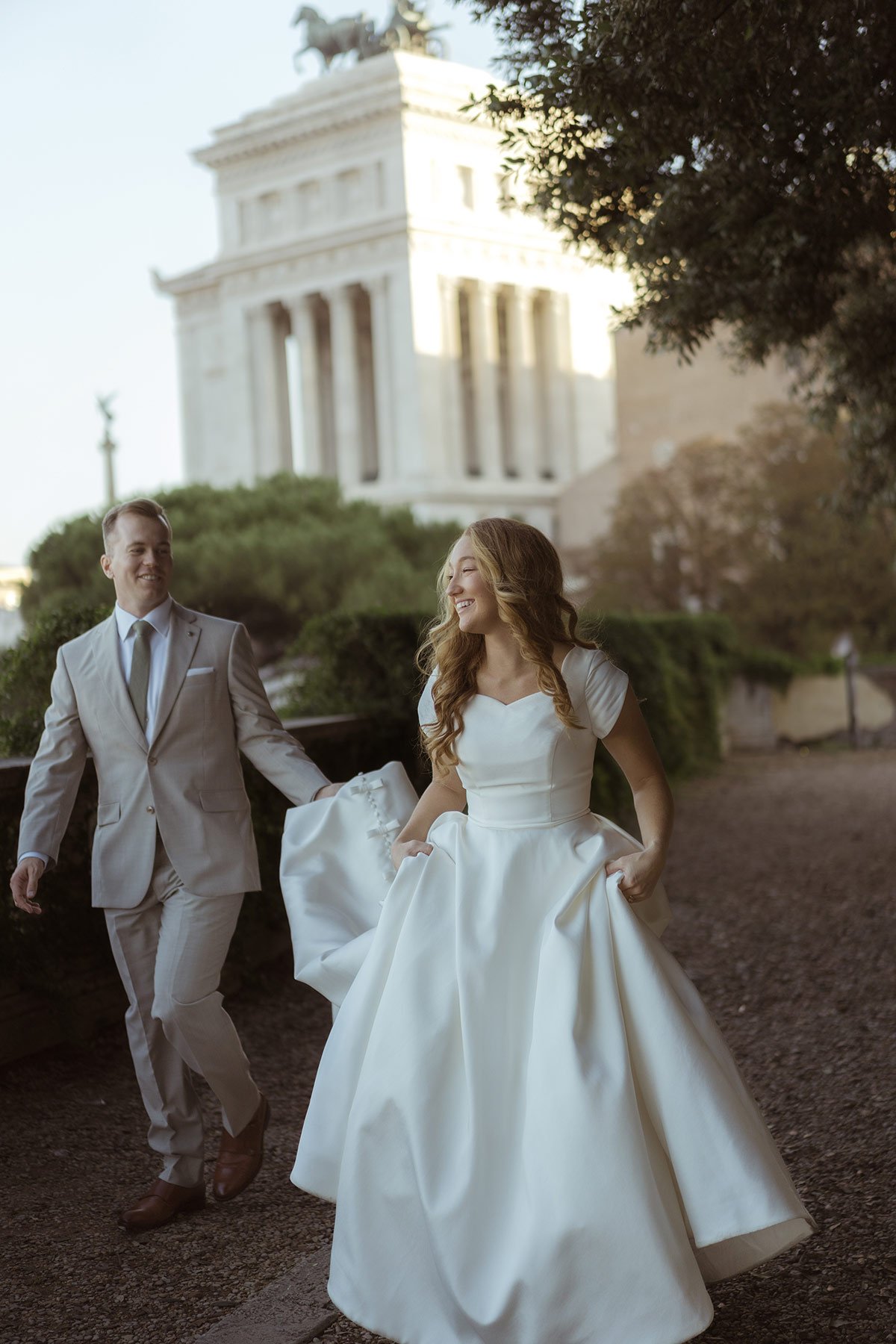Elegant couple walking together during an intimate elopement in Rome