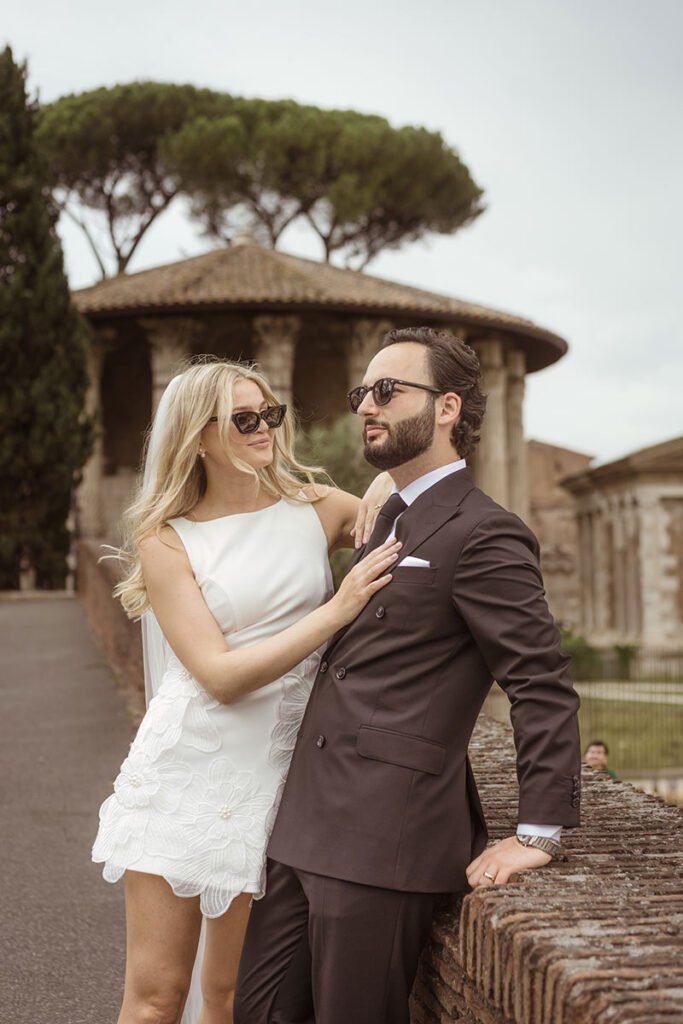 Bride and groom wearing sunglasses near the Temple of Hercules – stylish portrait by elopement photographer in Rome