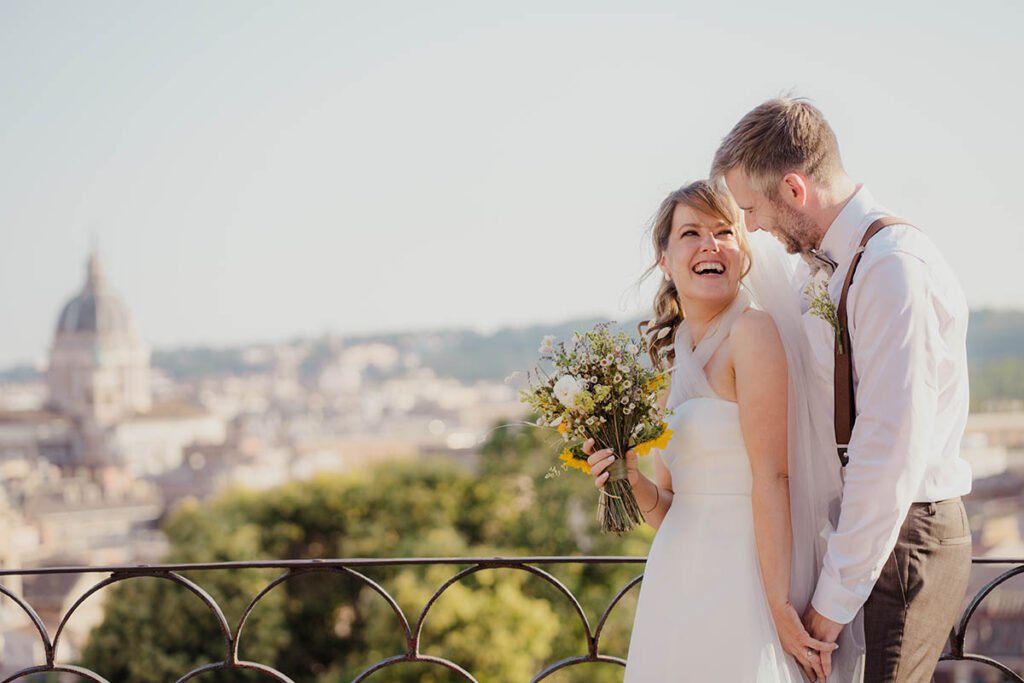 Couple sharing an intimate moment, smiling in the golden light.