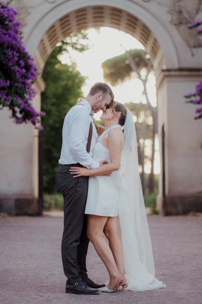 Couple laughing and embracing during a relaxed elopement shoot in Rome.