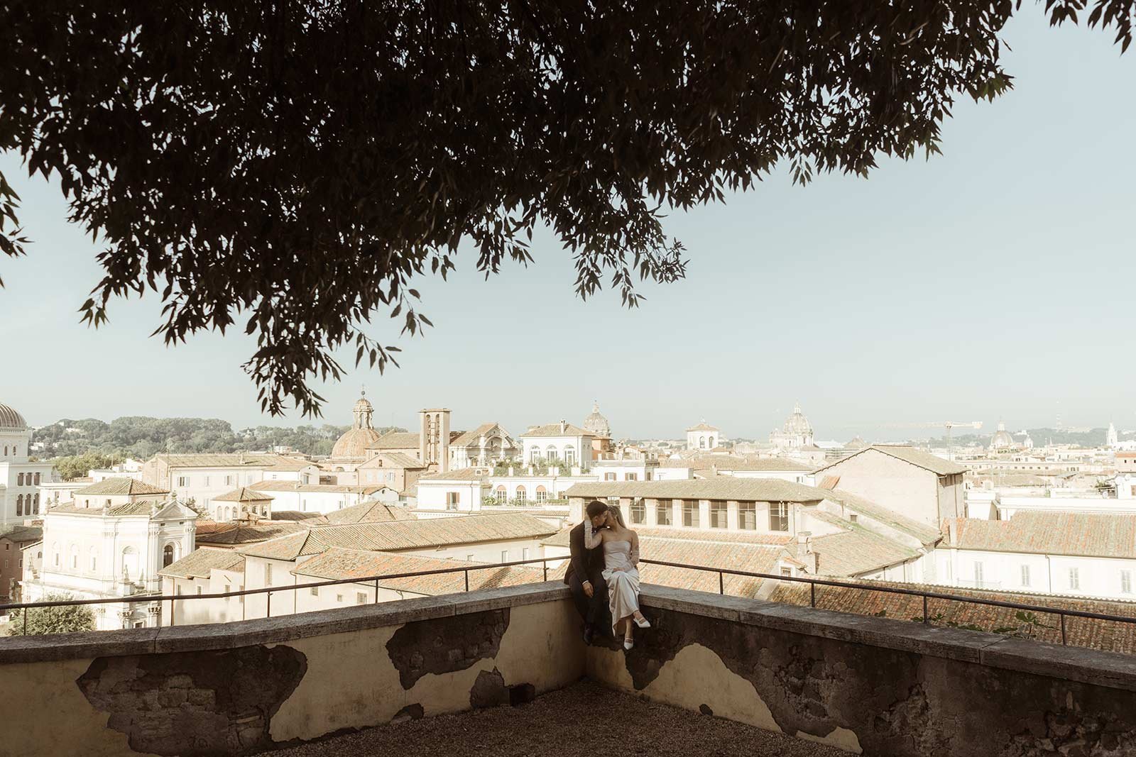 Couple enjoying panoramic view of Rome from terrace during elopement